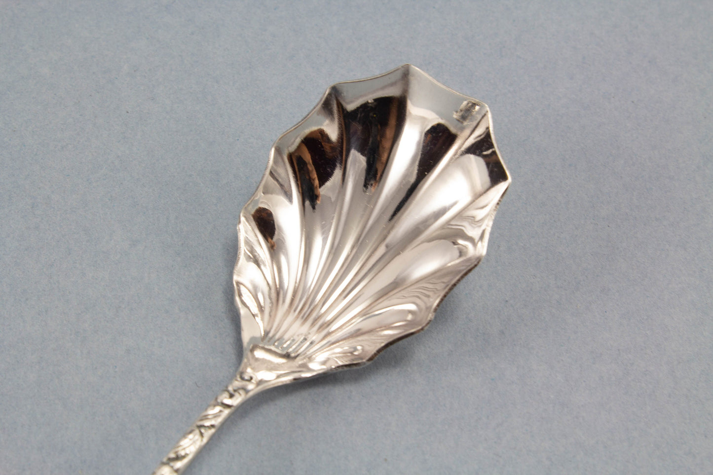 Small sugar spoon with roses, silver plated