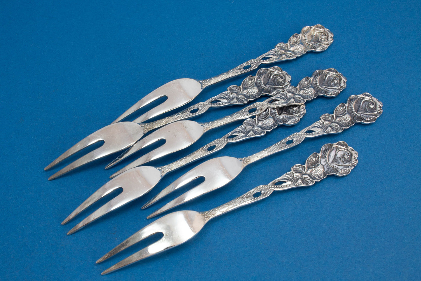 6 cocktail forks, small skewers