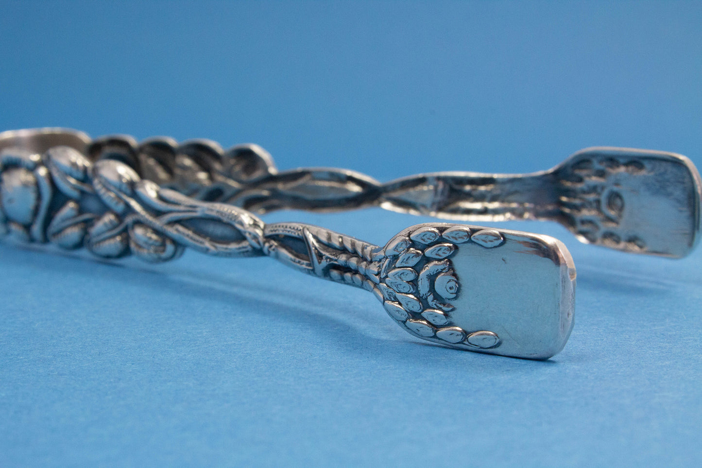 Silver plated sugar tongs with roses