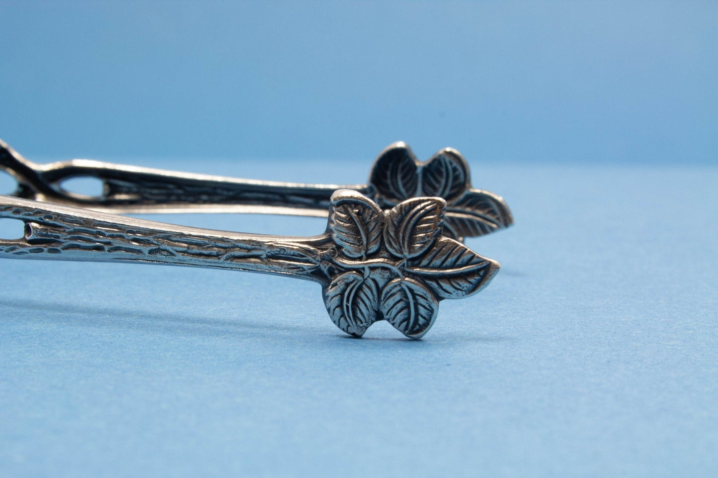 Zuckerzange mit Rosen , versilbert - Löffelland