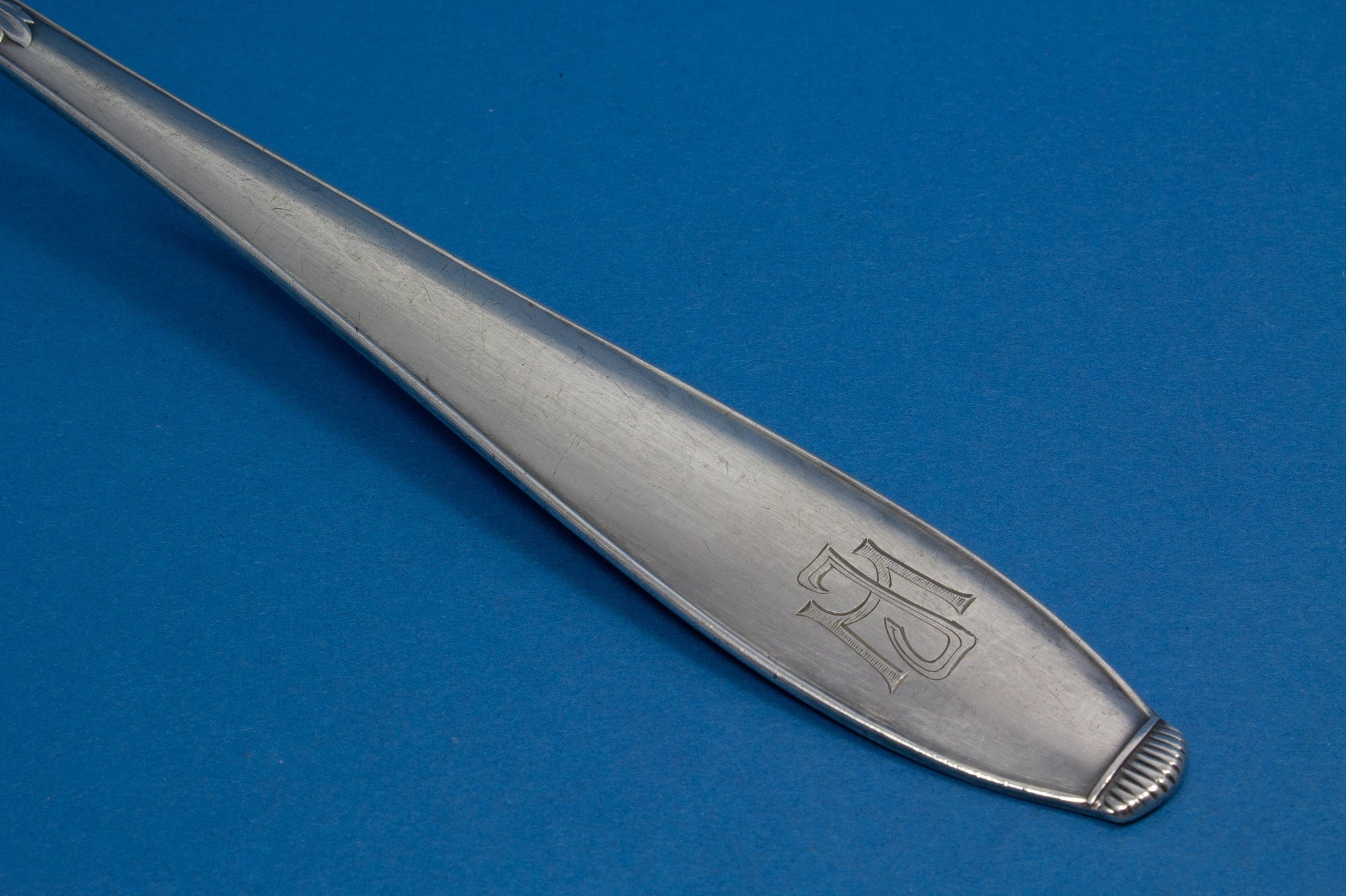 Silver plated soup trowel , engraved