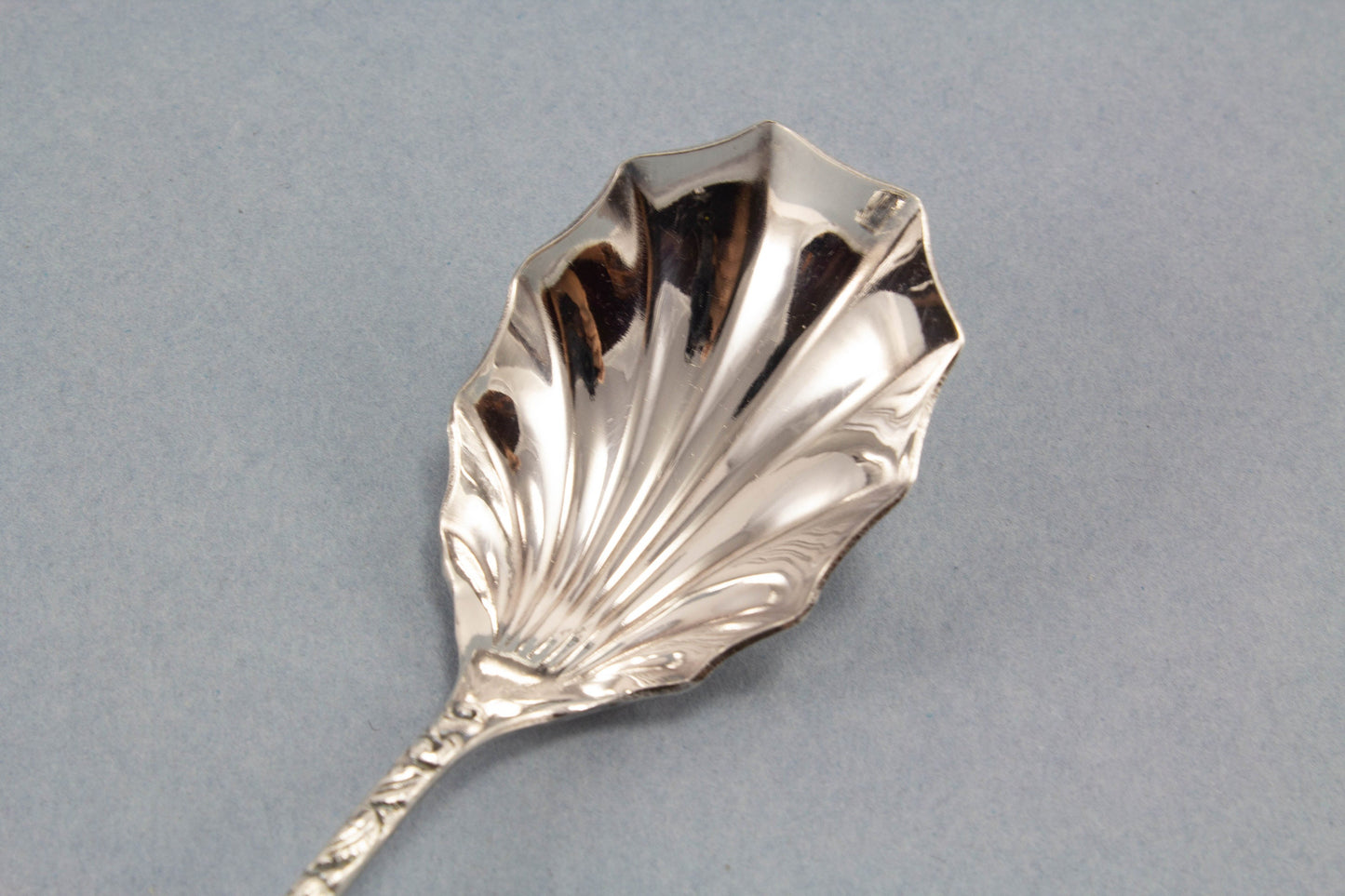Small sugar spoon with roses, silver plated 