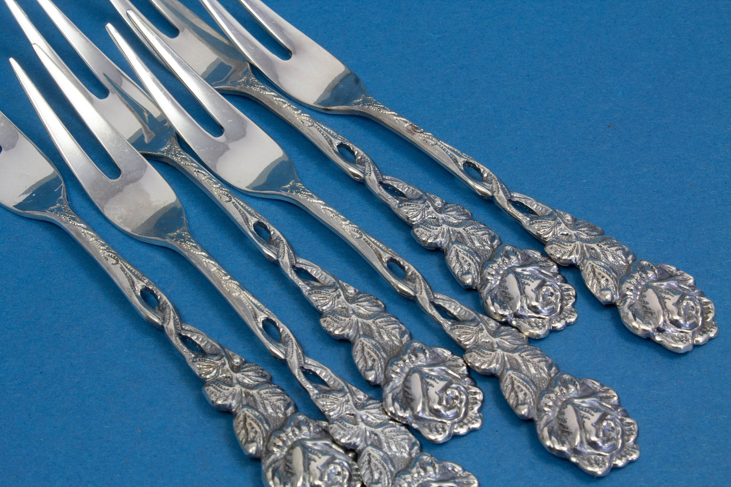 6 cocktail forks, small skewers
