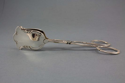 Versilberte Gebäckzange