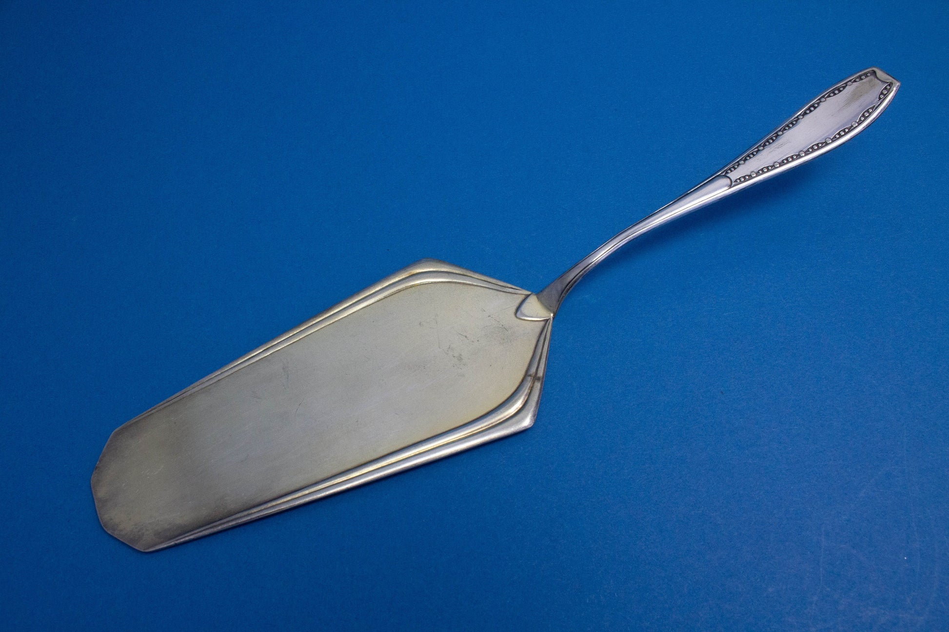 Silver-plated cake server with matching sugar tongs