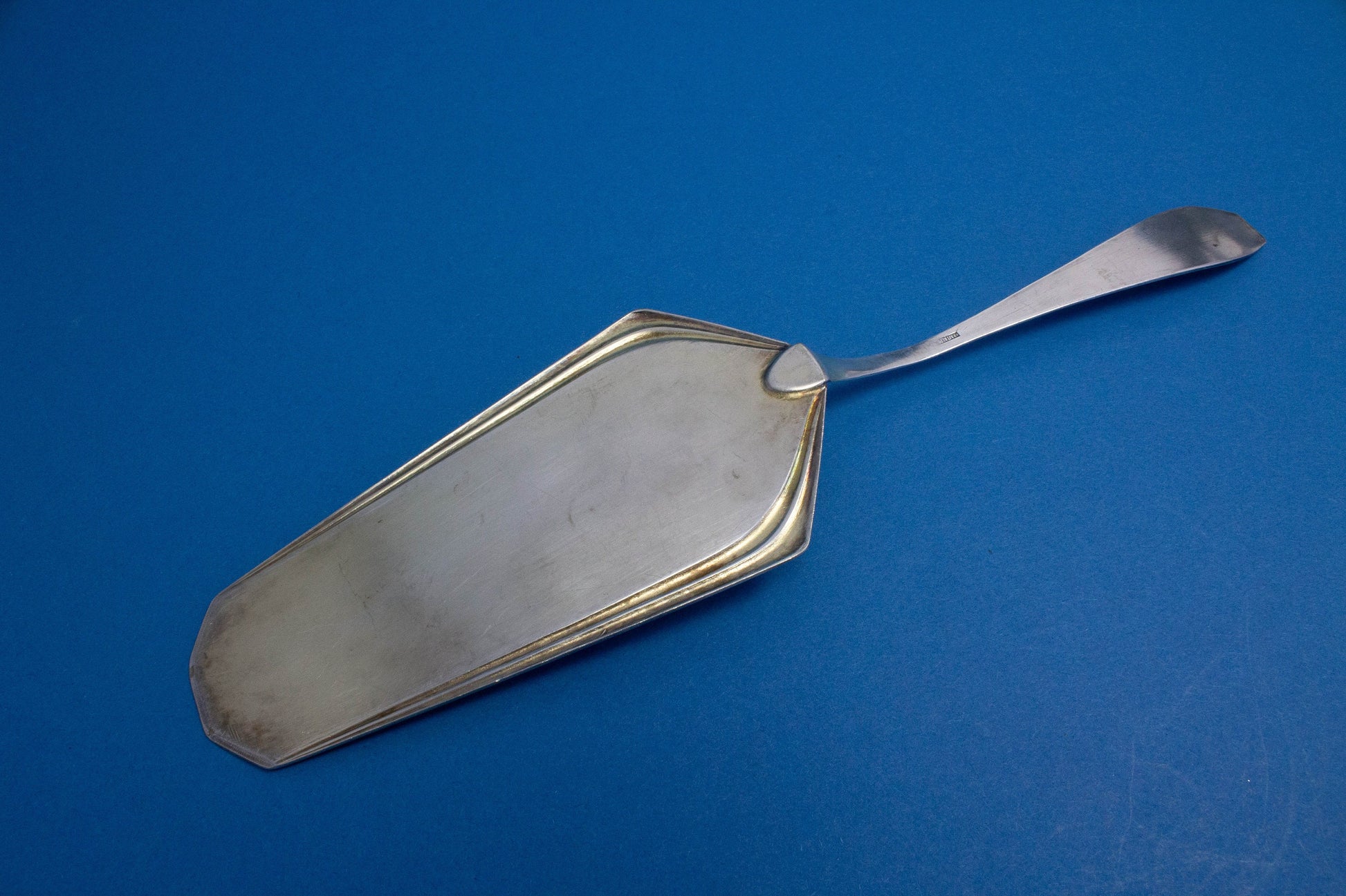 Silver-plated cake server with matching sugar tongs