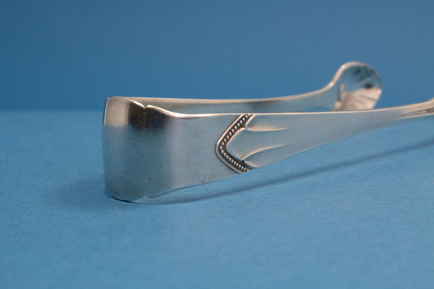 Silver plated sugar tongs with art nouveau pattern